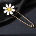 Gold tone metal safety pin brooch featuring a cute white and yellow enamel daisy flower. - Daisy Flower Style