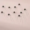 Gedetailleerd overzicht van U-vormige haarspelden met zwarte strass-bolkoppen voor chique knotjes. - Zwart