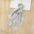 Floral print hair scrunchie with long ribbon scarf, detail view showing soft fabric and cute pattern. - Purple