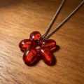 Red glossy glass flower pendant close up detail view sparkling necklace accessory item view detail - Red Petals