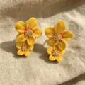 Yellow enamel flower earrings variant featuring dual flower design and golden glittering stamen. - Orange