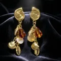 Close-up detail of golden resort-style seashell and amber bead tassel earrings for women. - Brown Crystal Pearl Tassel Earrings / Brown