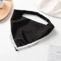 Close-up detail shot of the black triangle headscarf showcasing the elegant white lace trim. - Black
