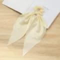 Chique gele stoffen haarscrunchie met lange striklinten voor dames staart haaraccessoires. - Geel