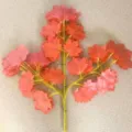 Detailed close-up view of artificial red maple leaf branch, showing realistic plastic foliage. - 12 Pieces/Pack / Autumn Red