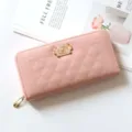 Elegante portafoglio lungo trapuntato rosa da donna con chiusura lampo e metallo dorato. - Rosa chiaro