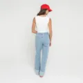 Ensemble mode femme chic composé d'un haut blanc sans manches et d'un pantalon rayé - S / Bas / Bleu