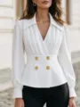 Close-up of elegant white V-neck pleated long-sleeve blouse with gold double-breasted buttons. - White