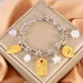Bracciale con ciondoli bicolore in acciaio inossidabile con cuori e stelle per donne. - Piastra Floreale in Strass Colorato