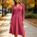 Detailed view of the elegant solid color V-neck long sleeve midi dress with cross pleat. - Rose Red