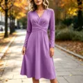 Elegant purple long sleeve midi dress featuring V-neck and stylish crossover pleated waist. - Purple