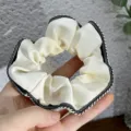 Elegant French retro satin hair scrunchie with chic black and white contrast edge for women. - Off White