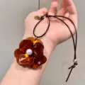 Leopard print resin flower pendant necklace with faux pearl, stylish braided rope sweater chain. - Brown