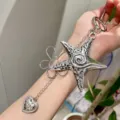 Silver star flower keychain detail view, stylish y2k aesthetic metal bag charm accessory. - Pentagram Star and Flower Pendant Necklaces / Silver
