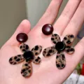 Leopard print flower earrings detailed view, showcasing the unique acrylic design and bold style. - Style B / Dark Brown