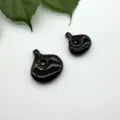 Detailed close-up of black spiral teardrop pendant for DIY handmade necklace jewelry. - Obsidian