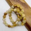 Heart-shaped natural stone loose beads detail view, perfect for DIY jewelry making. - Yellow Jade Approx. 38 Beads/String