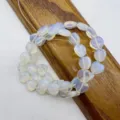 Heart-shaped opalite crystal loose beads detail view showing translucent shimmering texture. - Artificial Opalite