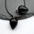 Teardrop black stone crystal pendant detail view, smooth polished gemstone necklace with silver bail. - Obsidian