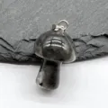 Close-up detail shot of a natural crystal carved mini mushroom pendant with a silver metal bail. - Black Labradorite (1 Piece)
