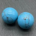 Detail shot of 20mm blue stone sphere with black veins, close-up texture display. - Blue Turquoise