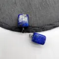 Detailed close-up view of natural lapis lazuli square gemstone pendant showcasing unique texture. - Lapis Lazuli (1 Piece)