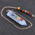 Detailed close-up view of wire-wrapped chakra crystal pendulum with multi-colored stones. - Synthetic Opal