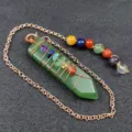 Detailed look at the green aventurine crystal pendulum featuring chakra beads and chain. - Green Aventurine