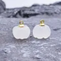 Detail shot of 13-14mm carved white jade pumpkin charm with gold loop for DIY jewelry. - White Jade