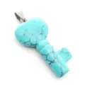 Turquoise heart key pendant detail shot showing unique blue stone texture and metal bail. - Synthetic Blue Turquoise