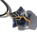 Close-up of wire wrapped star crystal pendant, exquisite tree of life detail and black cord. - Sodalite
