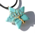 Detail view of a stunning star-shaped turquoise wire-wrapped tree of life pendant necklace. - Synthetic Blue Turquoise