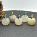Detail view of 5 natural stone apple pendants with gold enamel leaf for DIY jewelry making. - Natural Agate