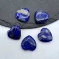 Natural lapis lazuli heart shaped polished crystal gemstone detail close up view display. - Lapis Lazuli