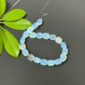 Close-up detail of light blue rectangular loose beads strand for DIY jewelry making accessories. - Synthetic Opal