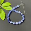 Blue sodalite square loose beads detail showing natural stone texture and irregular shapes. - Sodalite
