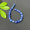 Close-up detail of natural lapis lazuli square loose beads, perfect for DIY jewelry making. - Lapis Lazuli