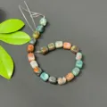 Close-up of irregular square gemstone loose beads, showing natural multi-color stone details. - India Agate
