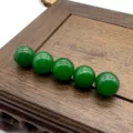 Green gemstone loose beads detail shot, smooth round 10mm stone spheres for DIY jewelry making - Malaysian Jade