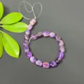 Close-up detail of irregular square purple amethyst loose beads strand for DIY jewelry making. - Amethyst