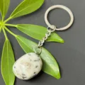 Natural crystal tumbled stone stainless steel keychain detail showcasing polished mineral pendant. - 15-20mm Tumbled Stone / Tianshan Blue Stone Keychain