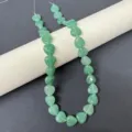 Detailed view of 12mm natural green stone heart-shaped loose beads strand for DIY jewelry making. - Green Aventurine Strand