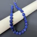 Natural blue gemstone heart beads detail shot, perfect for DIY jewelry necklace parts. - Dyed Lapis Lazuli