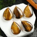 Natural tiger eye teardrop pendant with gold plated edge, fashion jewelry accessory variant. - Tiger's Eye