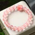Stunning natural pink crystal heart bracelet featuring glossy round beads for women and girls. - Watermelon Red (Synthetic)