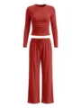Close-up detail of brick red long sleeve gathered top and wide leg lounge trousers. - XS / Top And Bottom / Bright Red