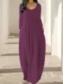 Vue détaillée de la robe longue unie à manches longues avec poches portée par le mannequin. - S / Robes / Violet Raisin
