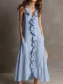 Detail view of a light blue sleeveless maxi dress featuring vertical ruffles and pockets. - Light Blue