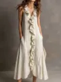 Detail view of the sleeveless V-neck maxi dress featuring center ruffle and elegant flow. - S / Dresses / Apricot