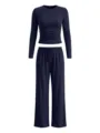 Close-up details of the dark blue long sleeve crop top with waist ruching and wide leg pants. - XS / Top And Bottom / Navy Blue